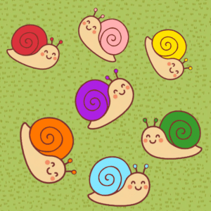 Conjunto de caracoles de colores sobre césped para actividad infantil en CEI Caracola Utrera.